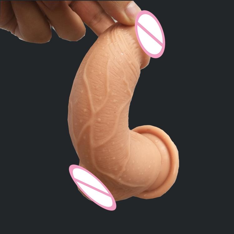 Image of a lifelike dildo with a suction cup base for hands-free pleasure.